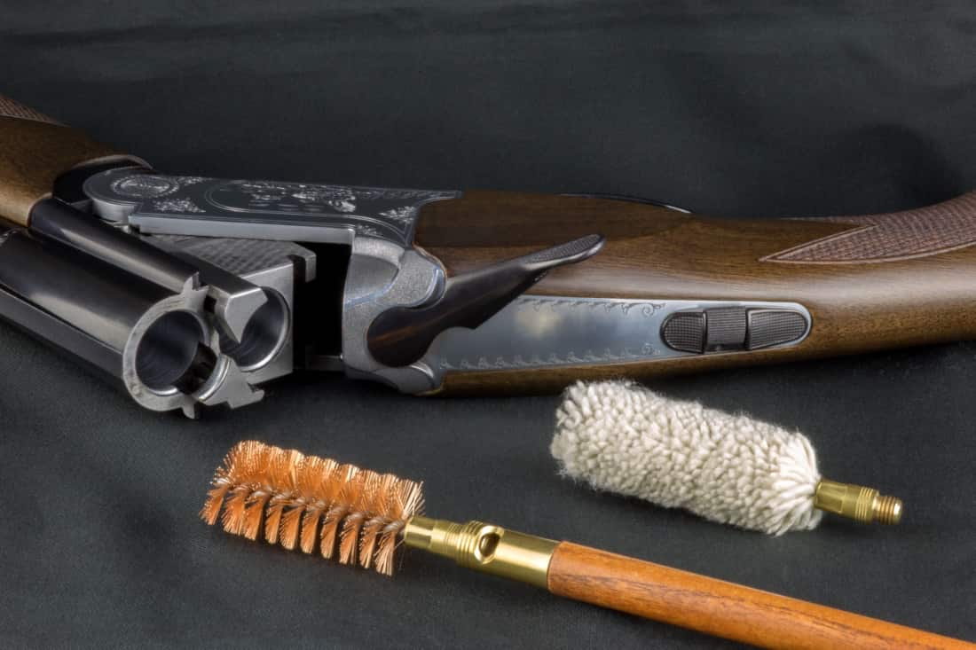 shotgun and cleaning tools